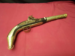 An Old Flintlock pistol with maybe silver trimmigs 
L39cm. H100cm.