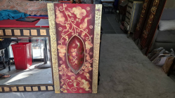 A Painting on Canvas raised gold Lanna-style a red background. Dimensions 120x60 cm
