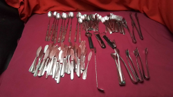 A Box of Cutlery ice cream spoon small Forks and butter knives 
Food tongs 6 piece
Openers (center)3 piece
Butter knives 47 piece 
Catering Cutlery 
Long-handle 10 piece 
Dessert Forks 28 piece
Cake fork piece
