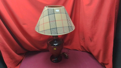 A Brown table Lamp with a burberry shade.
H64cm.
W10cm.
