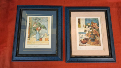A Pair of Still Life Art prints of 19 century famous masterpieces in lovely blue frames 31x38 cm signed.