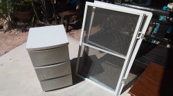 A Job lot of mosquito net and a plastic container 