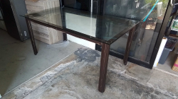 A Nice glass top table with leather clad frame.  
90x160x75cm.