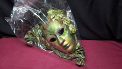 A green & gold Venetian style decorative masquerade