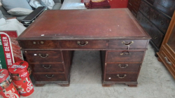 A Victorian partners .Desk with lovely brass handles and 9 drawers either sides leather Tooled top.
H77 W139 D100cm.