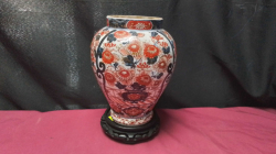 A Heavy Chinese Hand Painted vases on a wooden stand.
H22 W9cm.