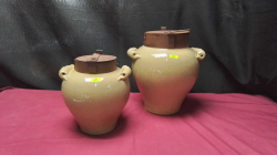 A Large and small pair of salt Glazed Lidded kitchen Jars.
W 10cm. H23cm. 