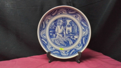 A blue Delft and white decoration plate on a stand.
H26cm. W26cm.