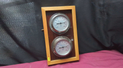 A Pair of Wail mounted thermometer. 
H34 W20cm. 