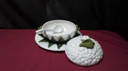 A Nice Portuguese soup dish on a tray with spoon.