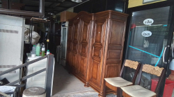 An Oak carved 4 door French wardrobe. 
H2.10m. W240 D55cm.