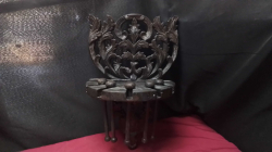 Vintage carved wooden wall bracket with scroll-leaf details.