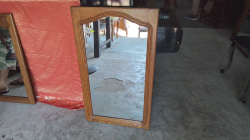 A Wooden Framed Mirror 
52x90cm.