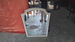 A Nice wall hanging mirror with some Carving to top . 
60x70cm.